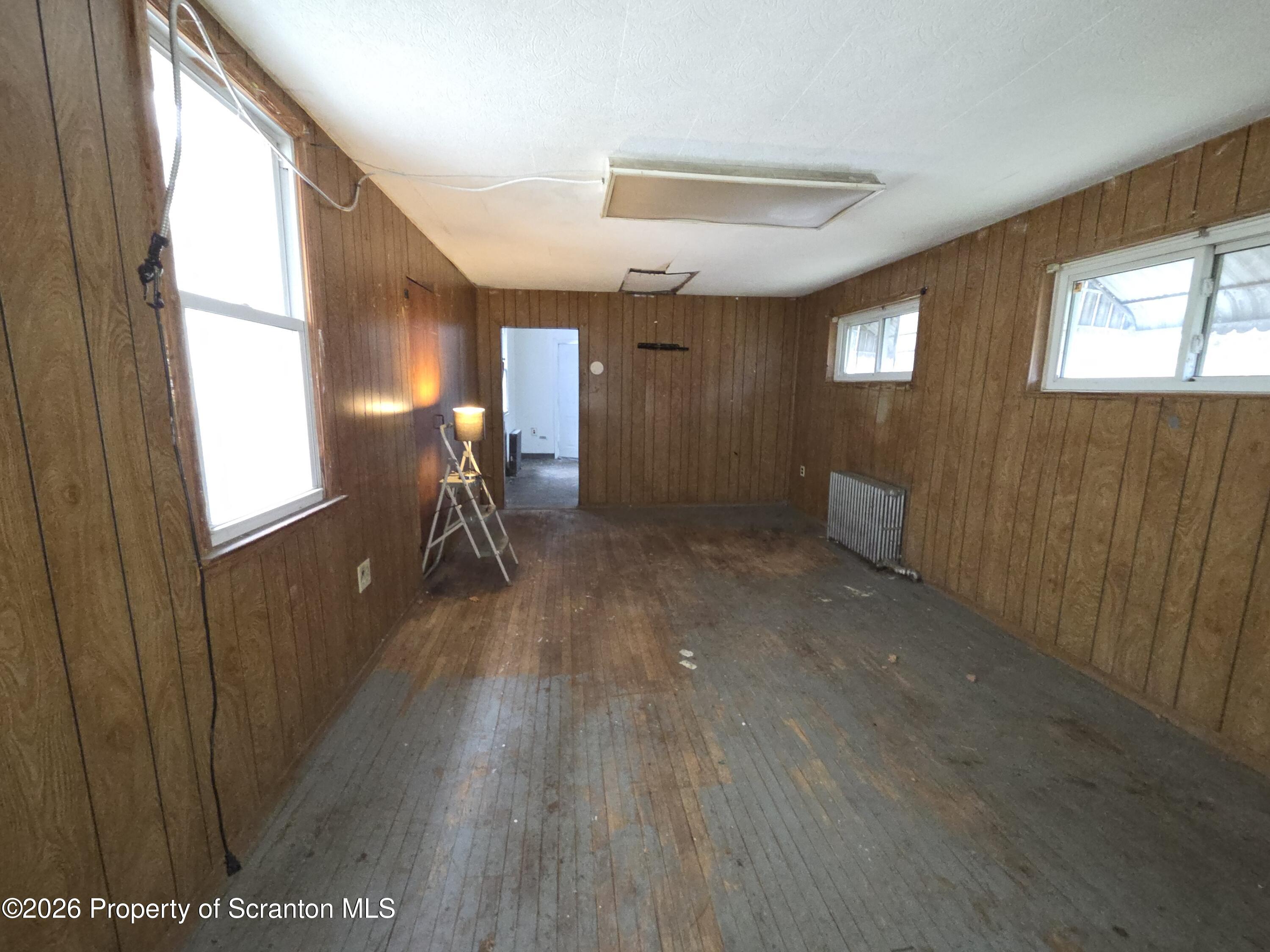 521 Albion Street Scranton, PA 18508 - Photo 10 of 22 a hallway with wooden floor chandelier and entryway