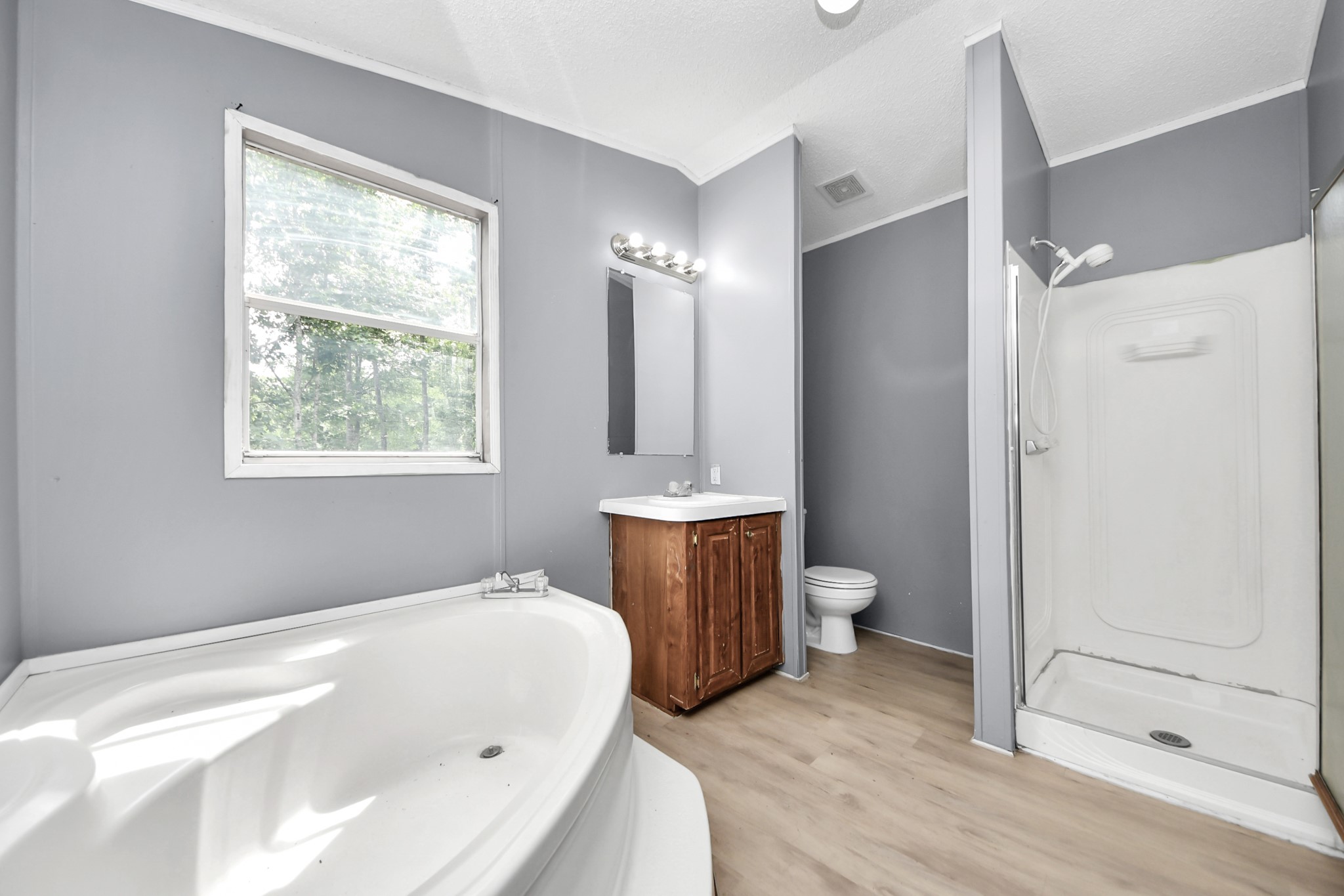 25932 Thatcham New Caney, TX 77357 - Photo 16 of 44 a bathroom with a bathtub toilet and a sink