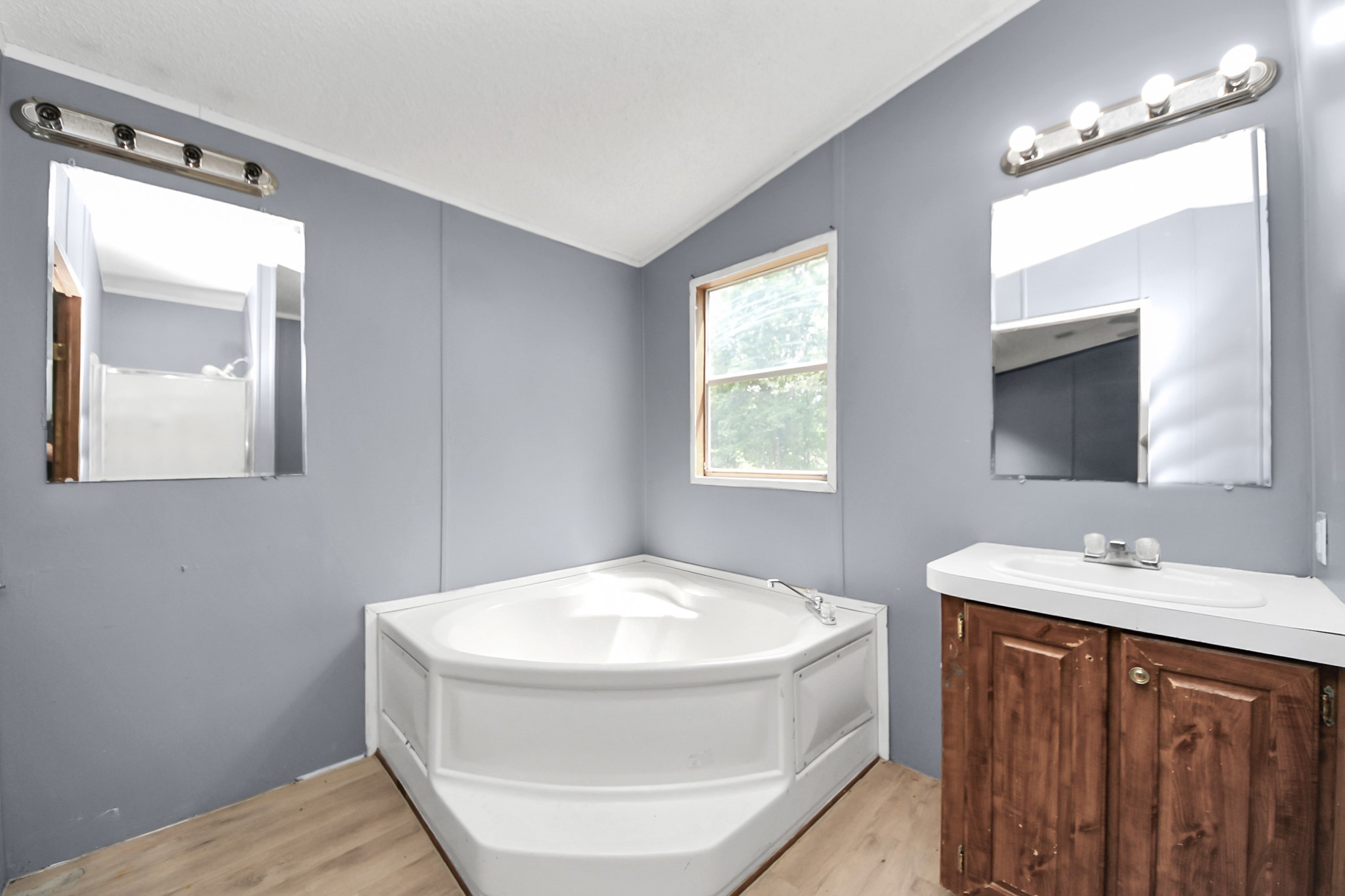 25932 Thatcham New Caney, TX 77357 - Photo 17 of 44 a bathroom with a sink a mirror and a toilet