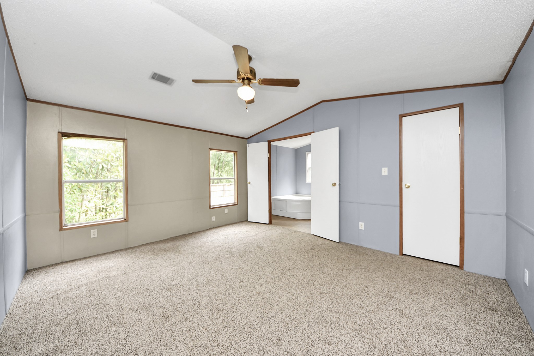 25932 Thatcham New Caney, TX 77357 - Photo 19 of 44 an empty room with windows and cabinet