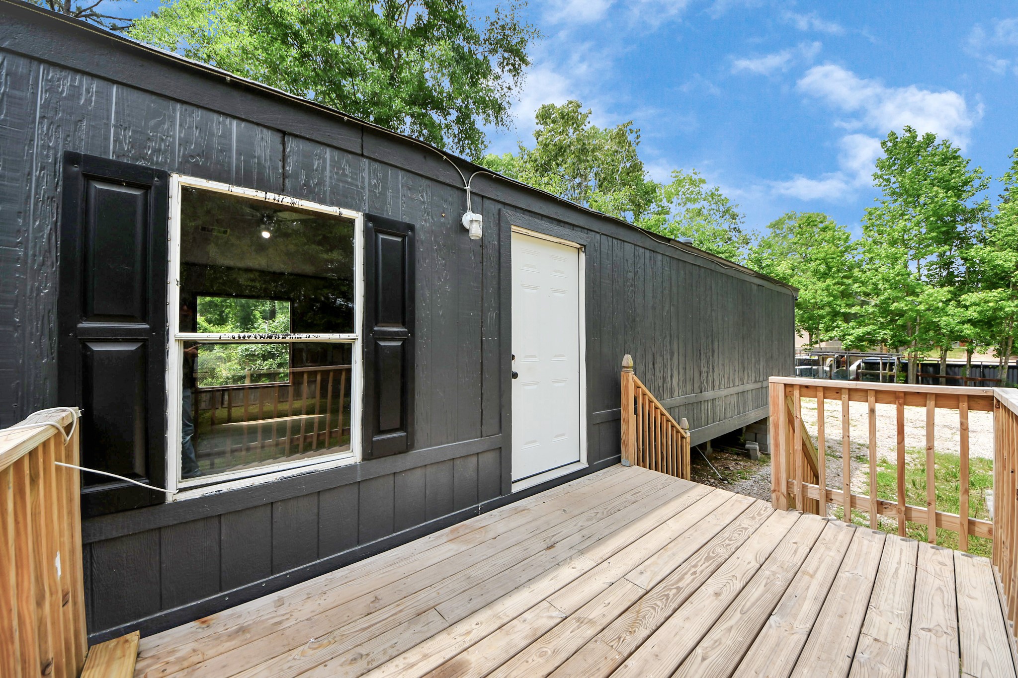 25932 Thatcham New Caney, TX 77357 - Photo 2 of 44 a view of backyard with a deck and wooden floor