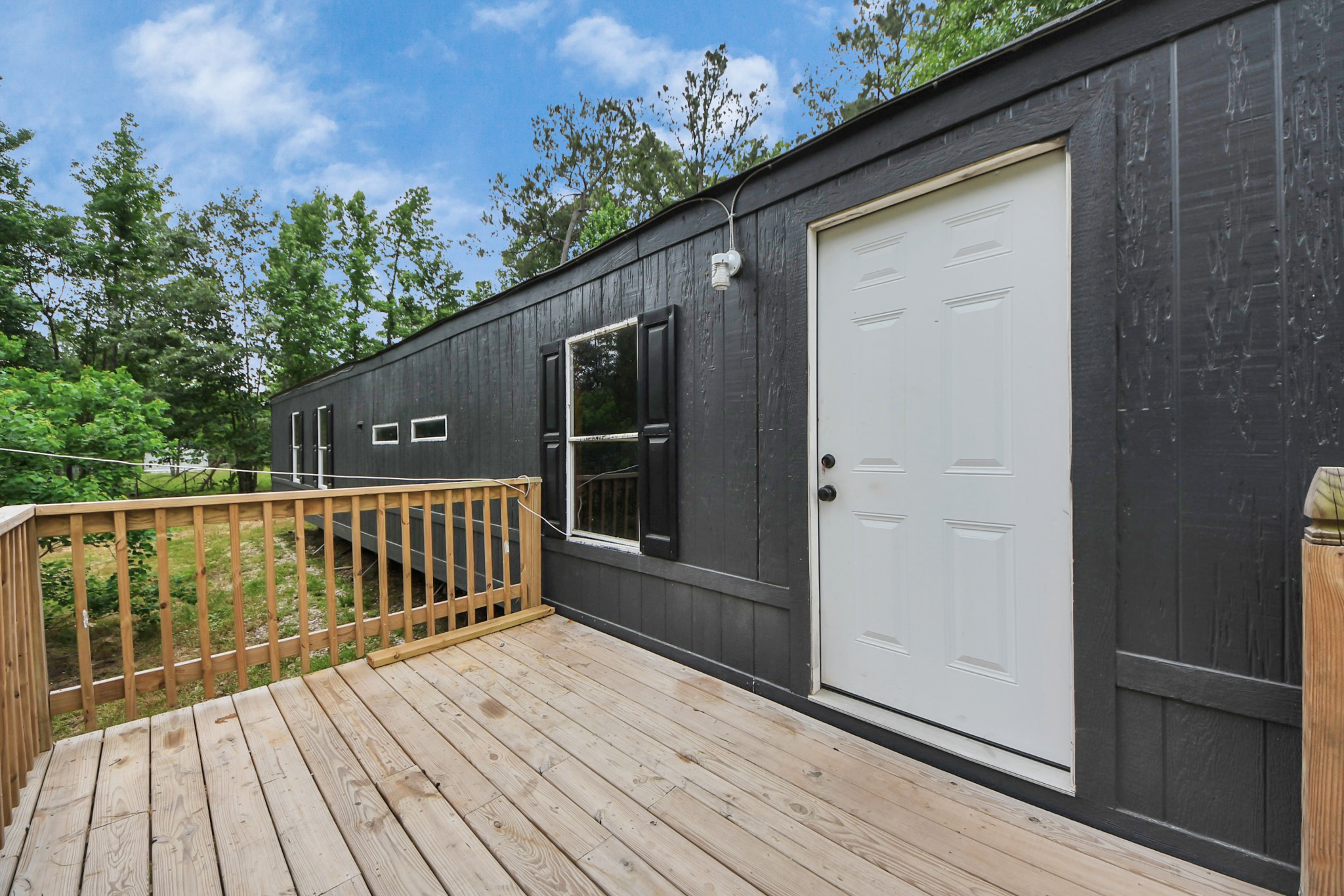 25932 Thatcham New Caney, TX 77357 - Photo 24 of 44 a view of balcony with wooden floor and fence