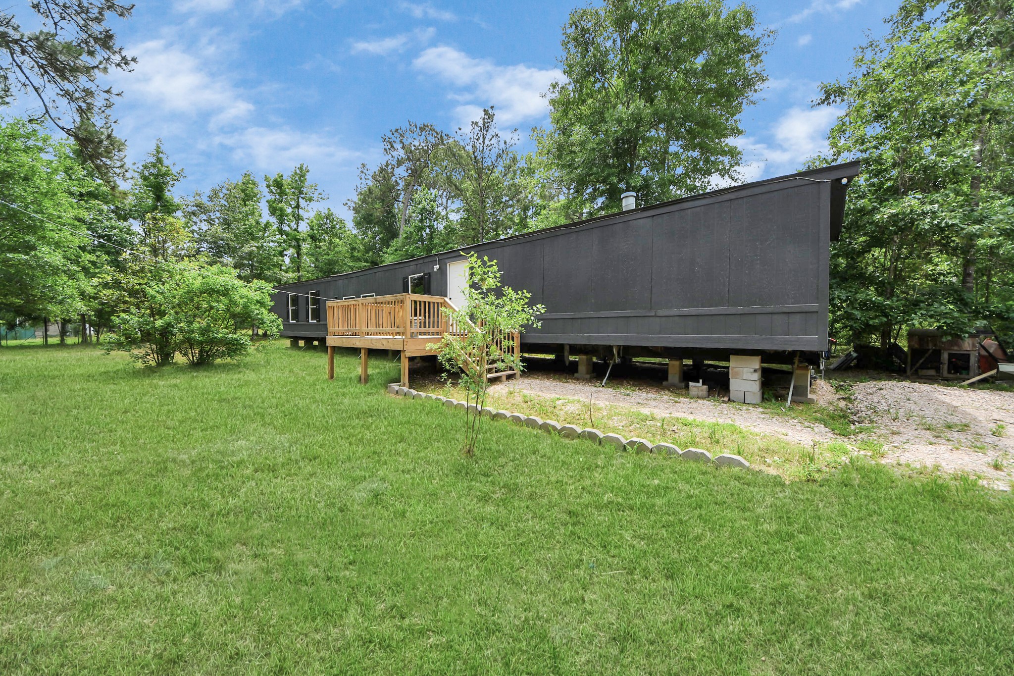 25932 Thatcham New Caney, TX 77357 - Photo 28 of 44 a house view with a garden space