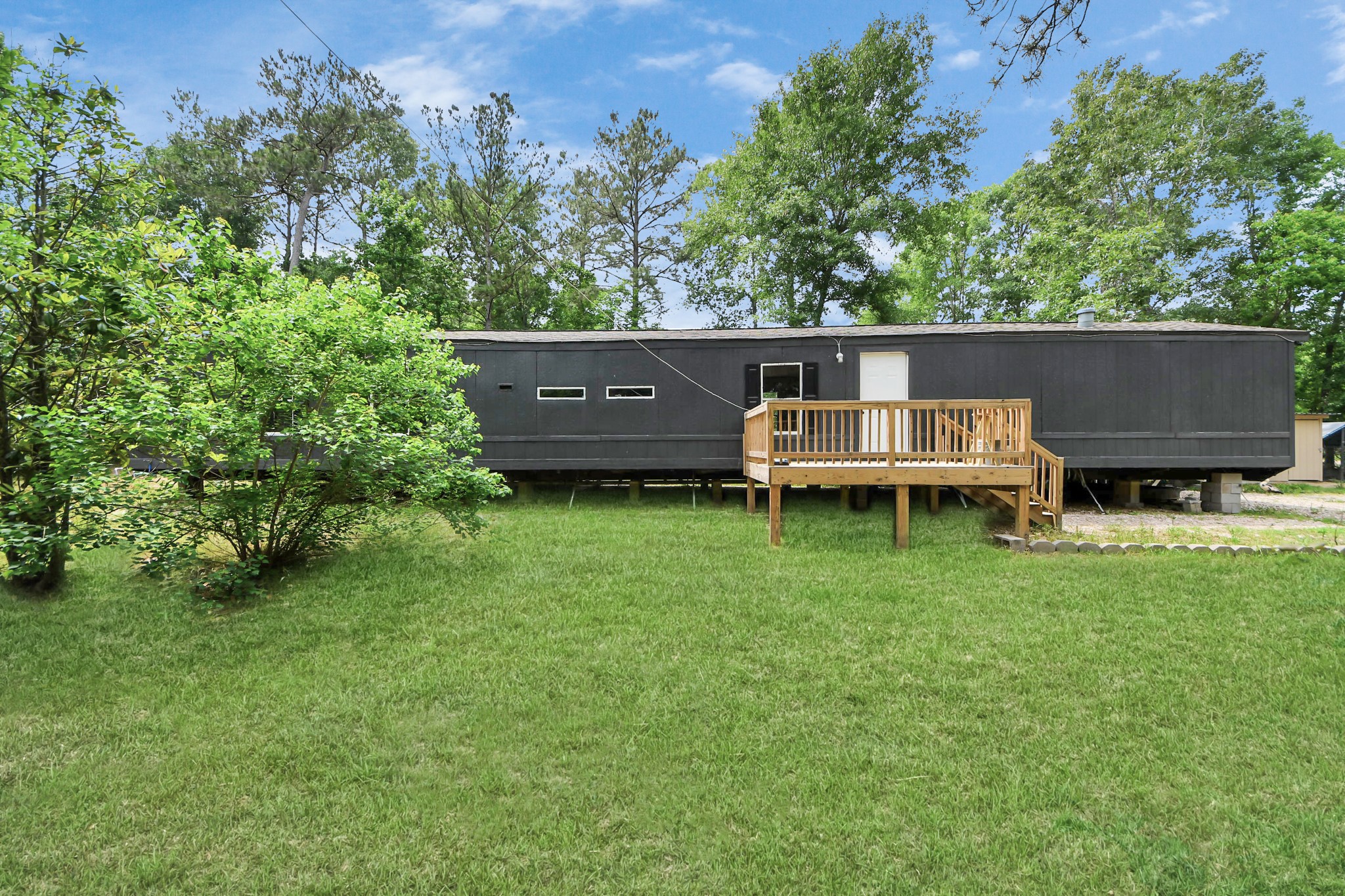 25932 Thatcham New Caney, TX 77357 - Photo 29 of 44 wooden house view with a garden space