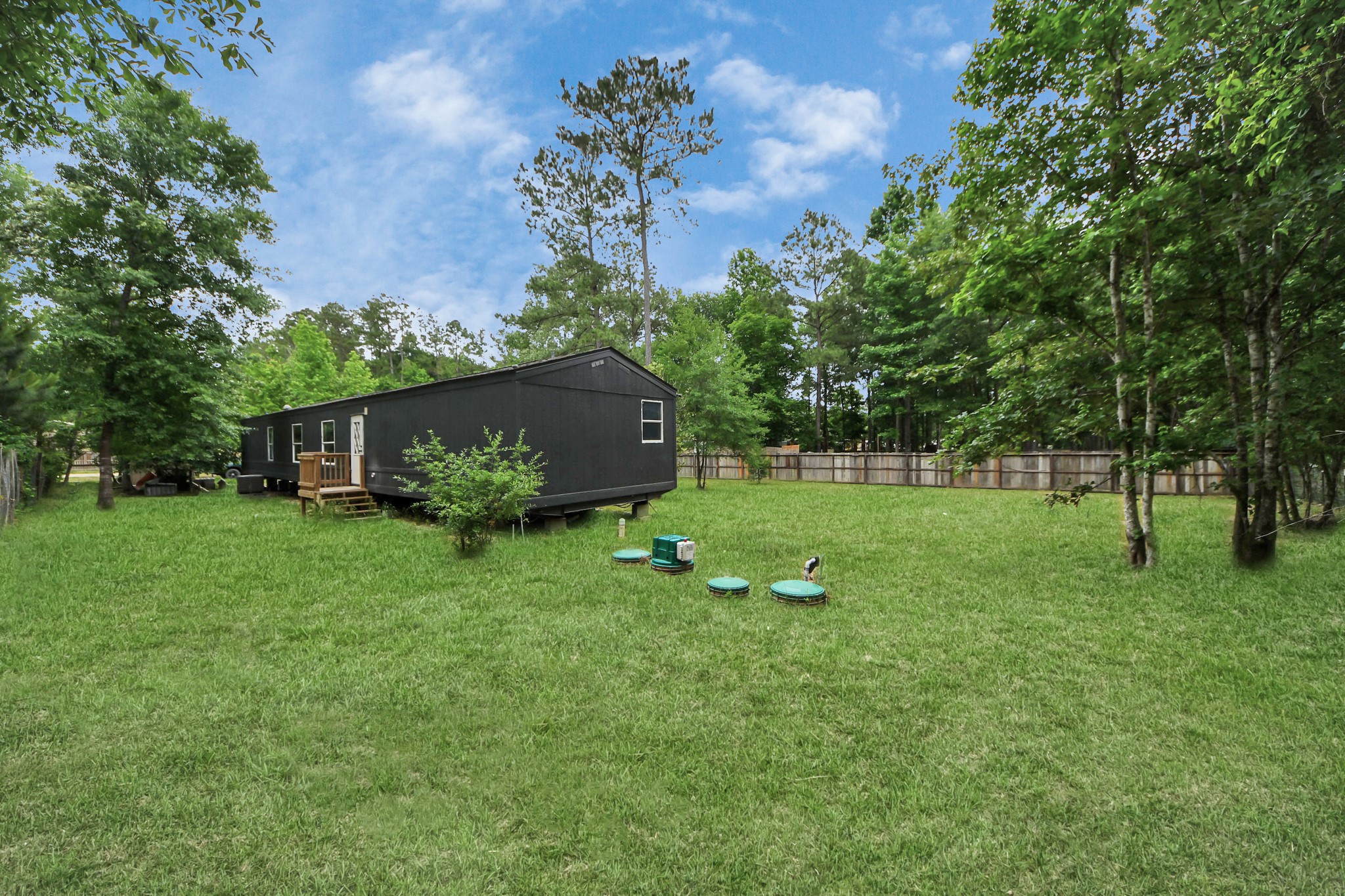 25932 Thatcham New Caney, TX 77357 - Photo 33 of 44 a view of a house with a backyard