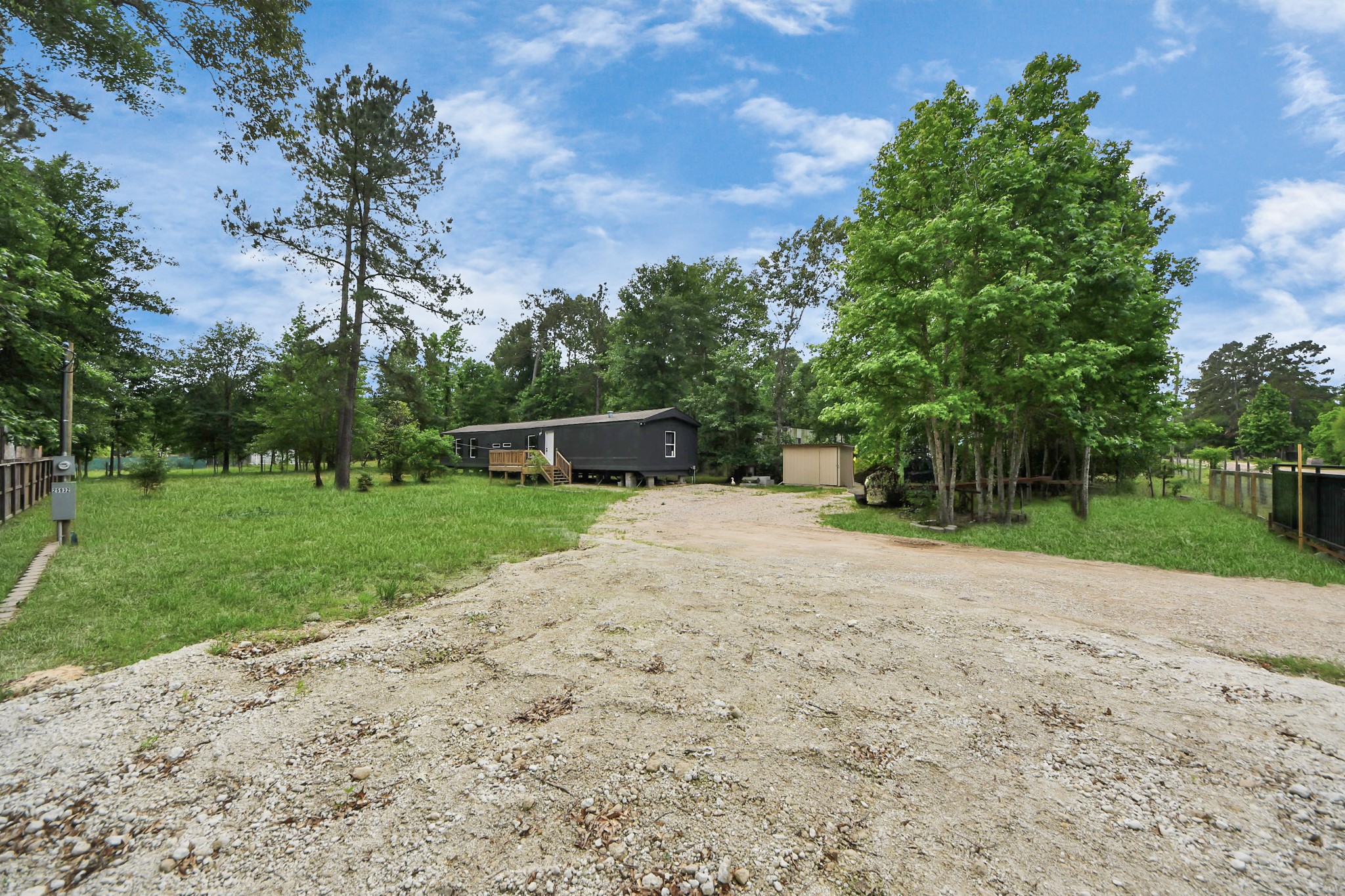 25932 Thatcham New Caney, TX 77357 - Photo 35 of 44 a view of a yard with plants and a trees