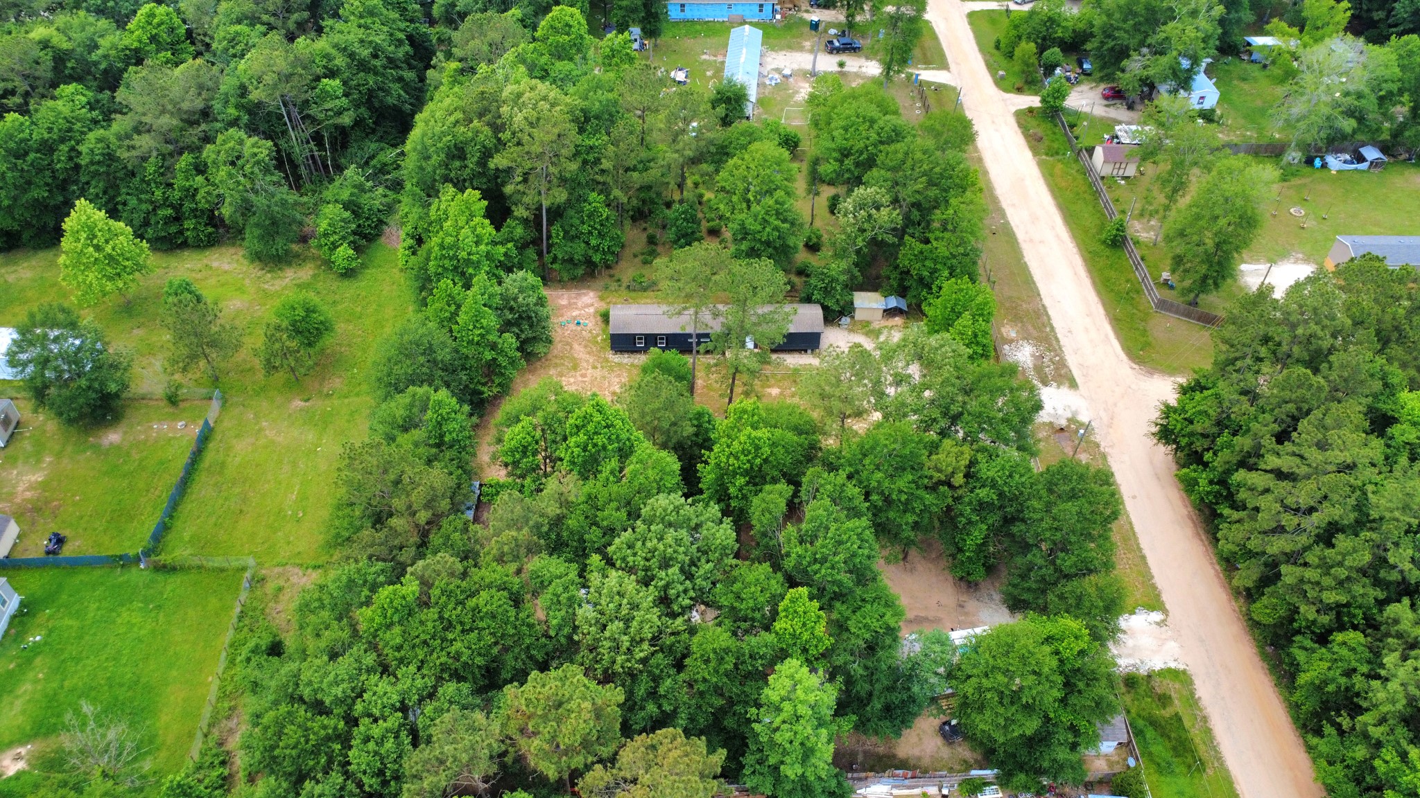25932 Thatcham New Caney, TX 77357 - Photo 37 of 44 an aerial view of residential house with outdoor space and trees all around