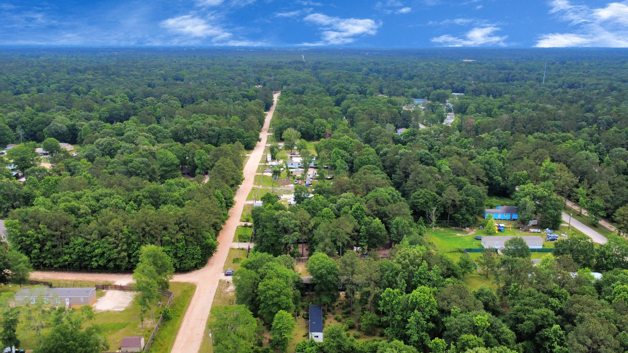 25932 Thatcham New Caney, TX 77357 - Photo 40 of 44 a view of a city with lush green forest
