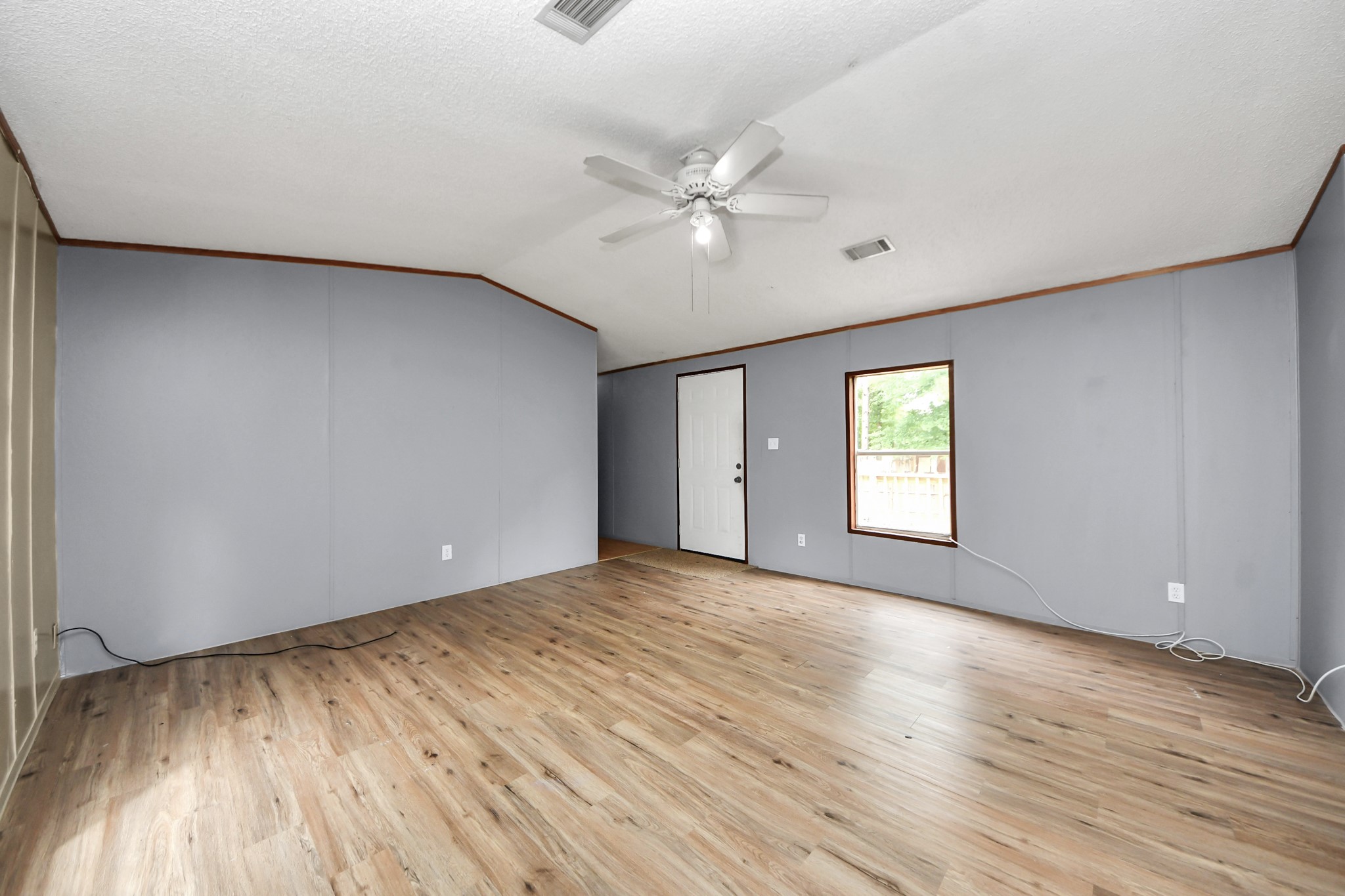 25932 Thatcham New Caney, TX 77357 - Photo 4 of 44 wooden floor in an empty room with a window