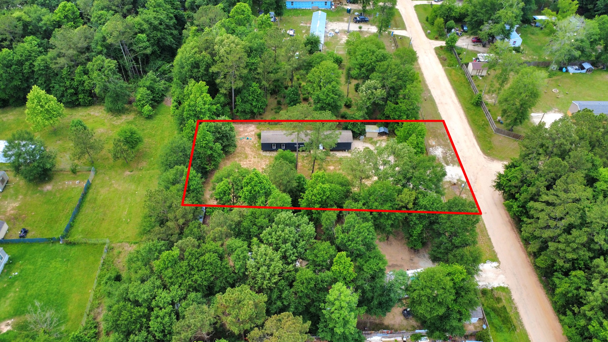 25932 Thatcham New Caney, TX 77357 - Photo 43 of 44 an aerial view of residential house with outdoor space and trees all around