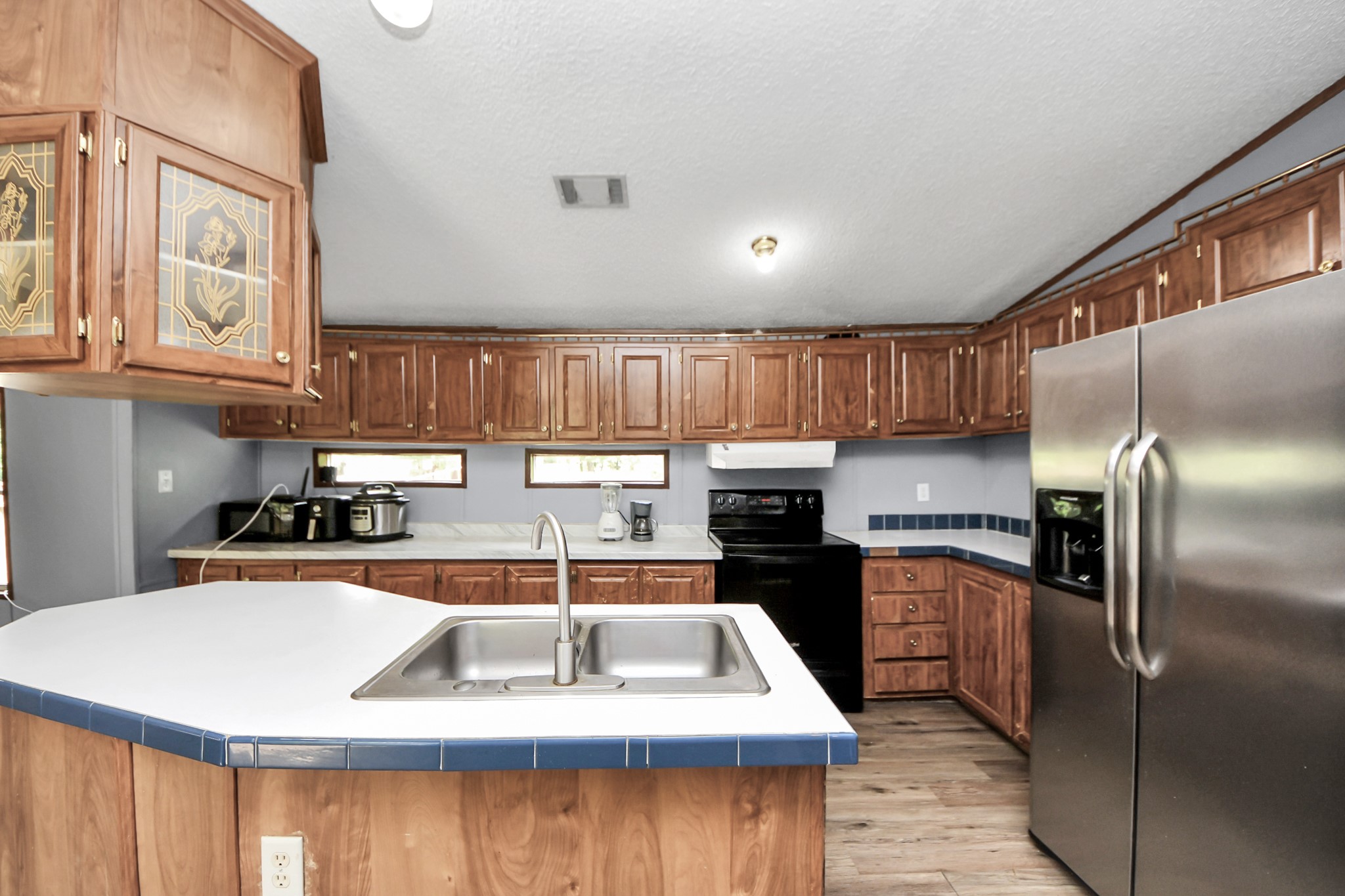 25932 Thatcham New Caney, TX 77357 - Photo 5 of 44 a kitchen with stainless steel appliances granite countertop a sink a stove and a refrigerator