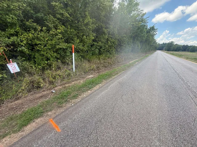a backyard of a house with a yard and lake view