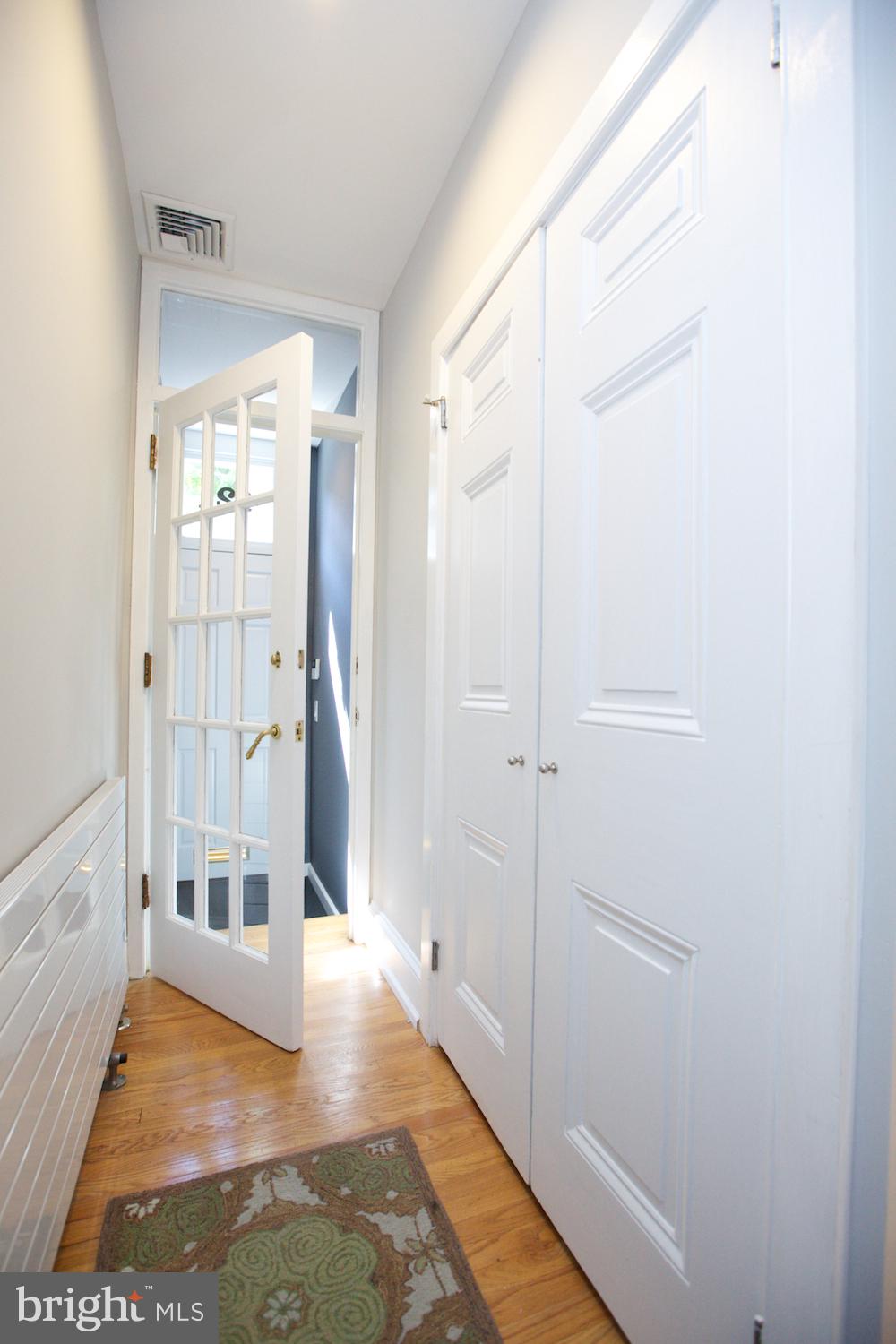 421 South 20th Street Philadelphia, PA 19146 - Photo 15 of 40 a view of a hallway with wooden floor and a bathroom