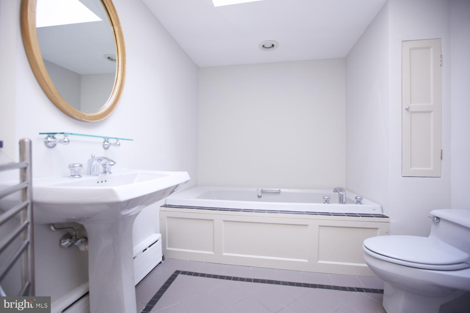 421 South 20th Street Philadelphia, PA 19146 - Photo 20 of 40 a bathroom with a sink a toilet and a mirror