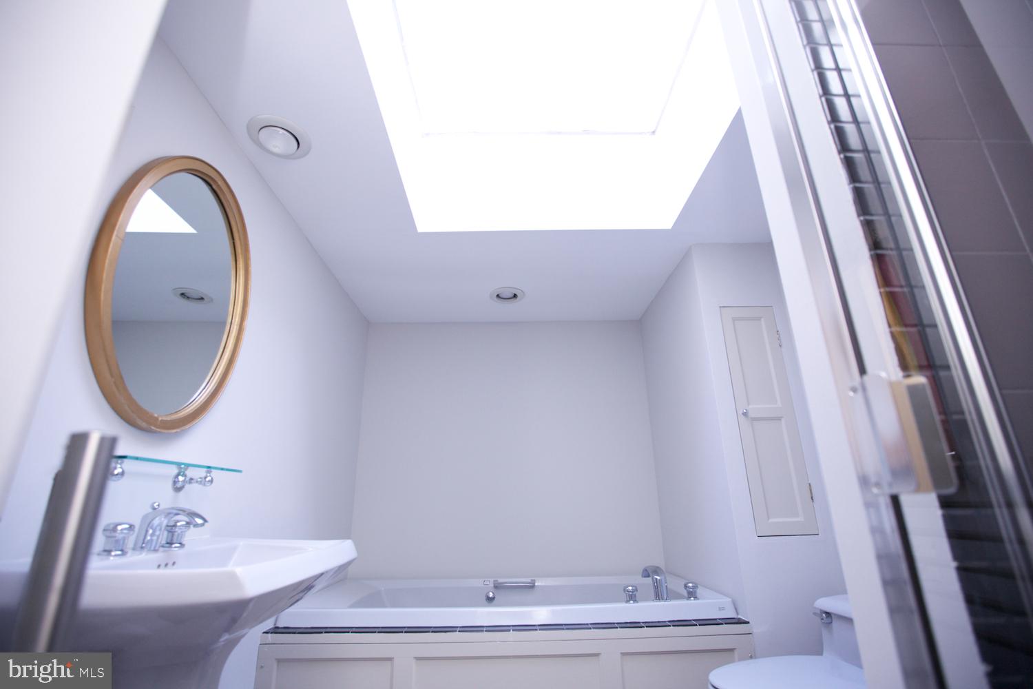 421 South 20th Street Philadelphia, PA 19146 - Photo 21 of 40 a bathroom with a sink and a mirror