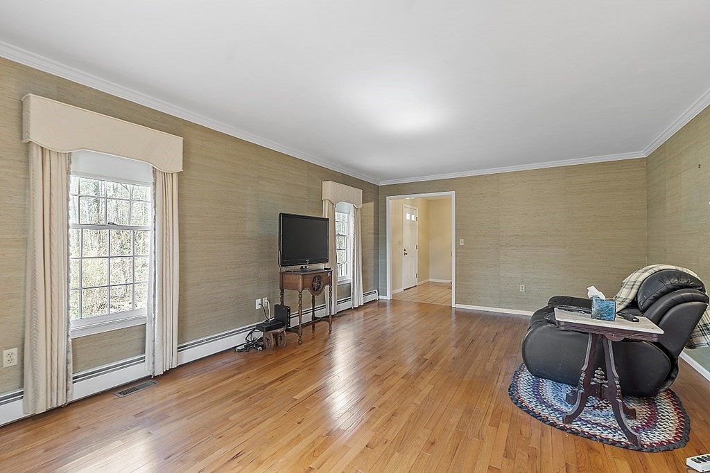 4 Horseshoe Road Windham, NH 03087 - Photo 4 of 32 a room with hard wood floors and a wooden floors