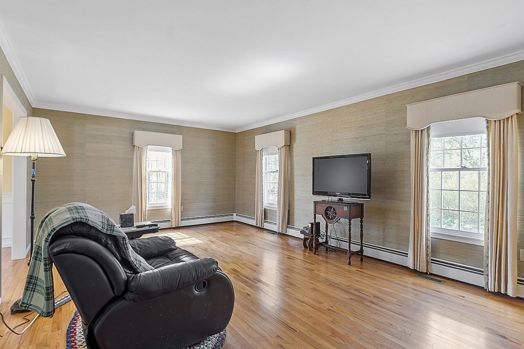 4 Horseshoe Road Windham, NH 03087 - Photo 5 of 32 a living room with furniture and a flat screen tv
