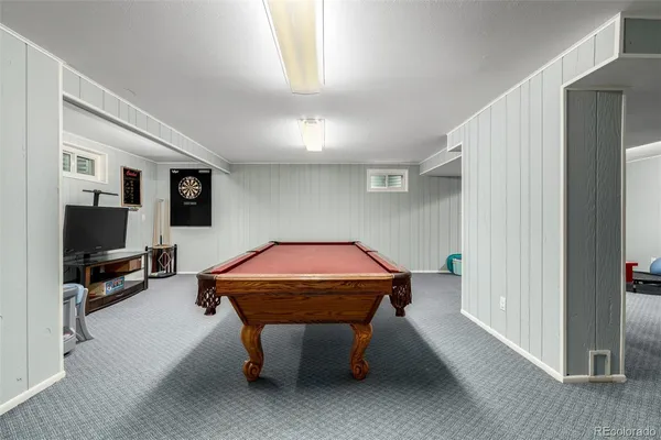 a room with furniture and flat screen tv