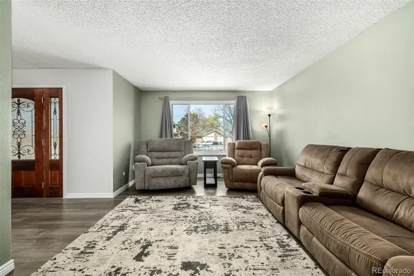 a living room with furniture and a couch