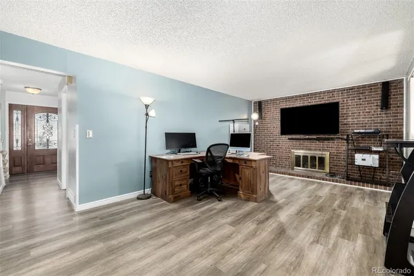a view of a livingroom with furniture and a flat screen tv