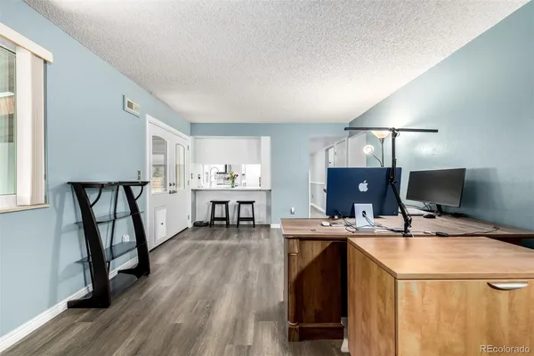 a workspace with furniture and wooden floor