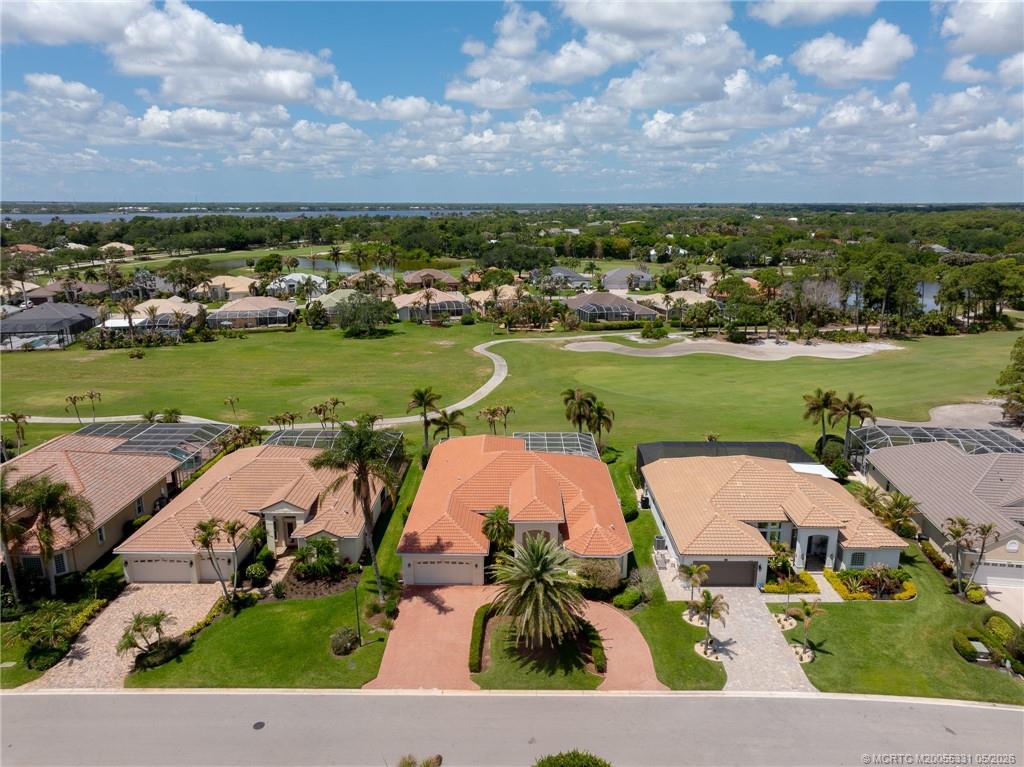 2216 Southeast Stonehaven Road Port St. Lucie, FL 34952 - Photo 55 of 67 an aerial view of residential houses with outdoor space and lake view