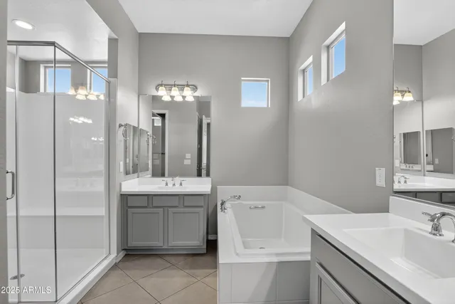 a bathroom with a shower sink and mirror