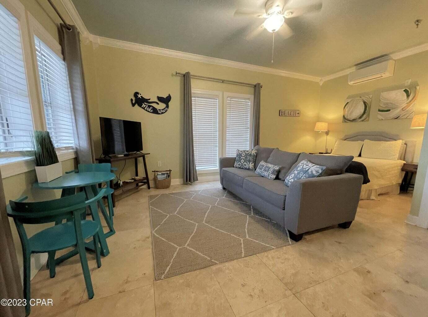 a living room with furniture and a flat screen tv