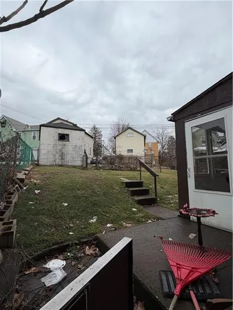 a view of a chairs and table in patio