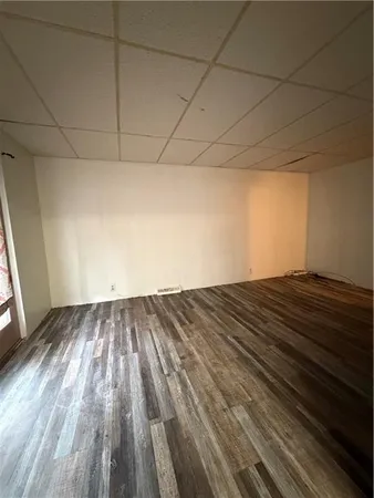 an empty room with large windows