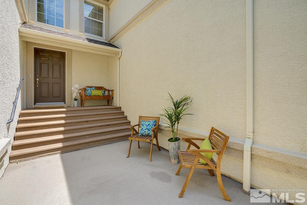 1883 Resistol Drive Reno, NV 89521 - Photo 3 of 23 a view of a chair and tables in the balcony