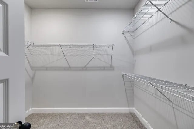 a view of a room with racks on the wall