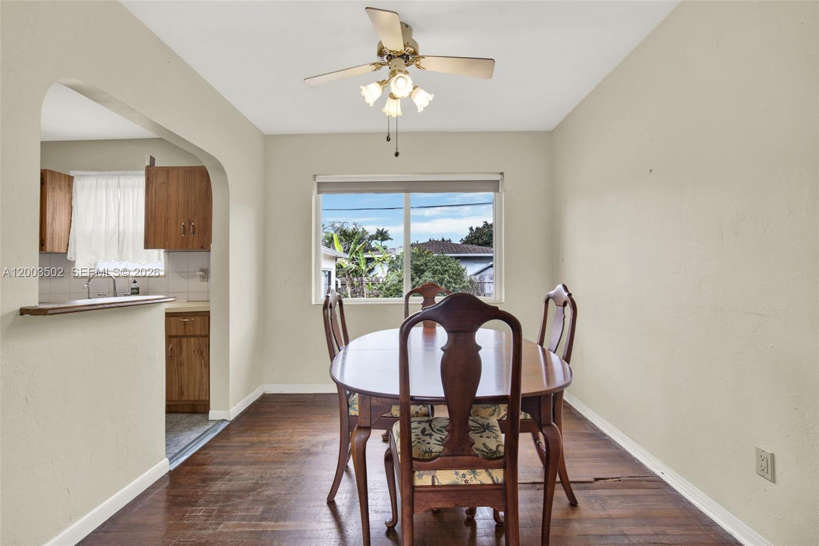 5701 Southwest 50th Terrace Miami, FL 33155 - Photo 11 of 46 a view of a dining room with furniture window and wooden floor