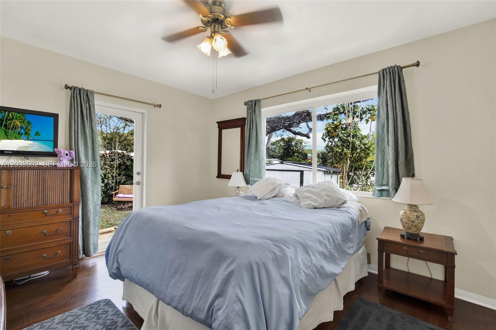 5701 Southwest 50th Terrace Miami, FL 33155 - Photo 17 of 46 a bedroom with a bed and a large window