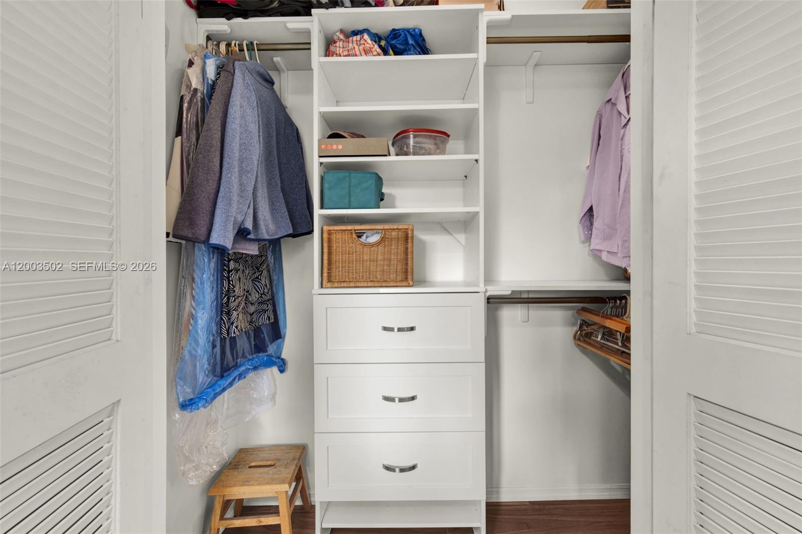 5701 Southwest 50th Terrace Miami, FL 33155 - Photo 18 of 46 a view of walk in closet with clothes and shoes