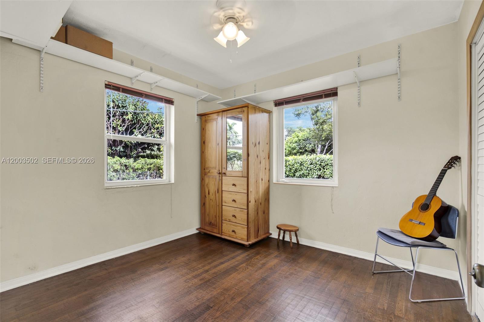 5701 Southwest 50th Terrace Miami, FL 33155 - Photo 19 of 46 wooden floor in an empty room with a window