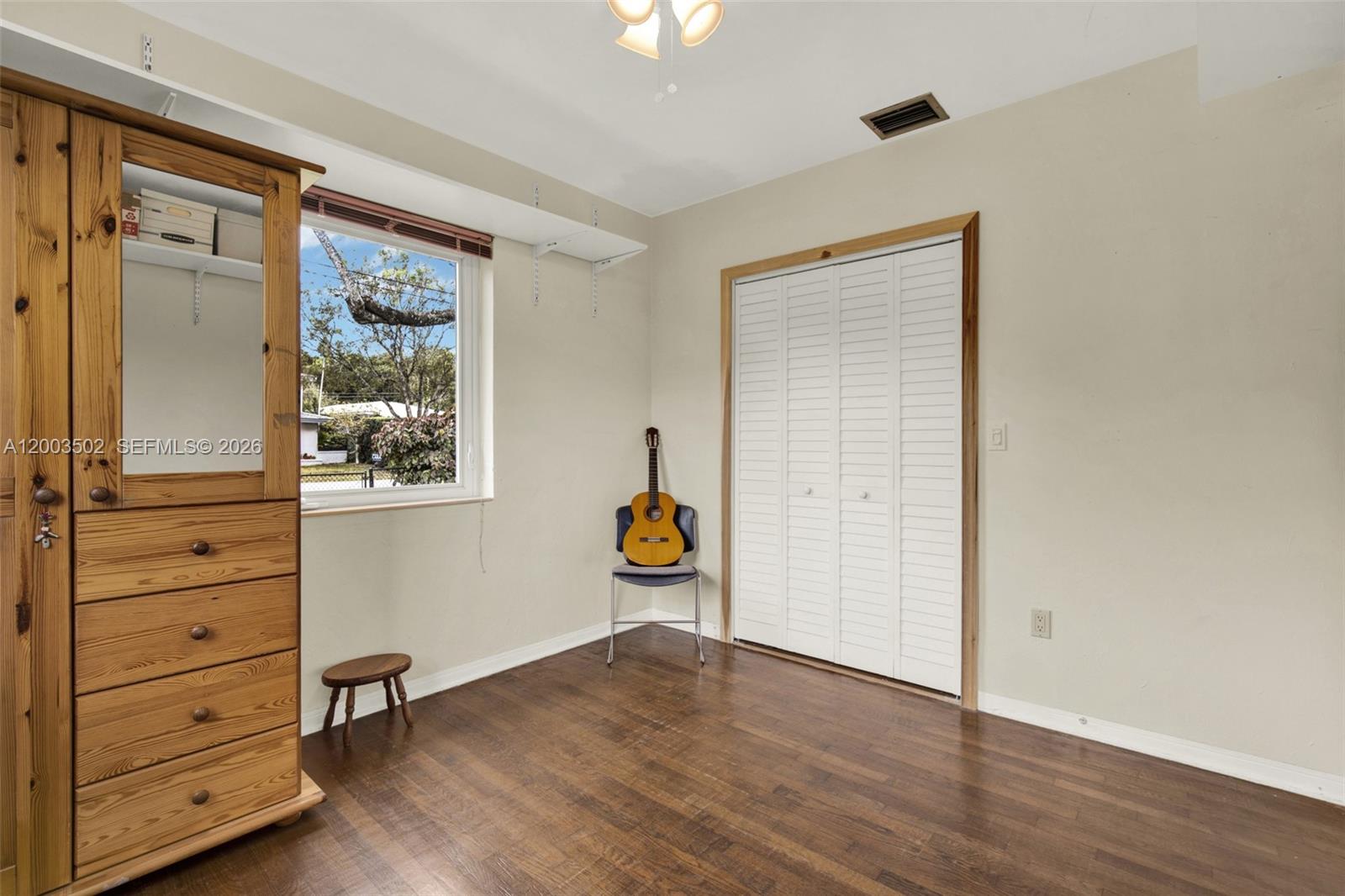 5701 Southwest 50th Terrace Miami, FL 33155 - Photo 20 of 46 wooden floor in an empty room with a window