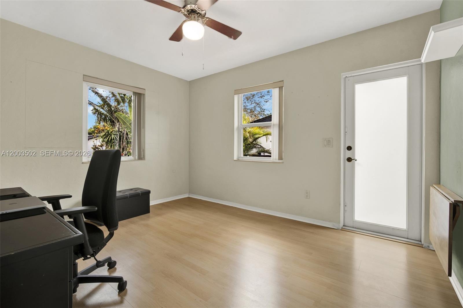 5701 Southwest 50th Terrace Miami, FL 33155 - Photo 22 of 46 a view of a workspace with furniture and a window
