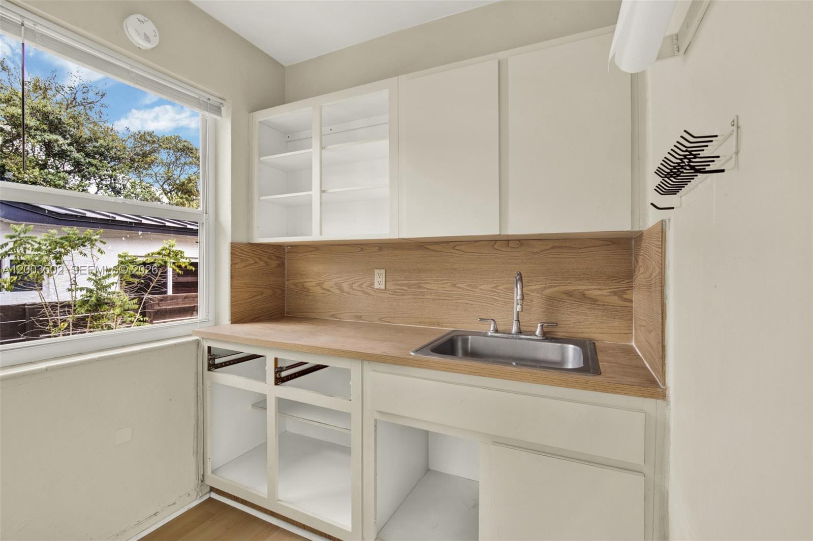 5701 Southwest 50th Terrace Miami, FL 33155 - Photo 23 of 46 a kitchen with a sink and a window