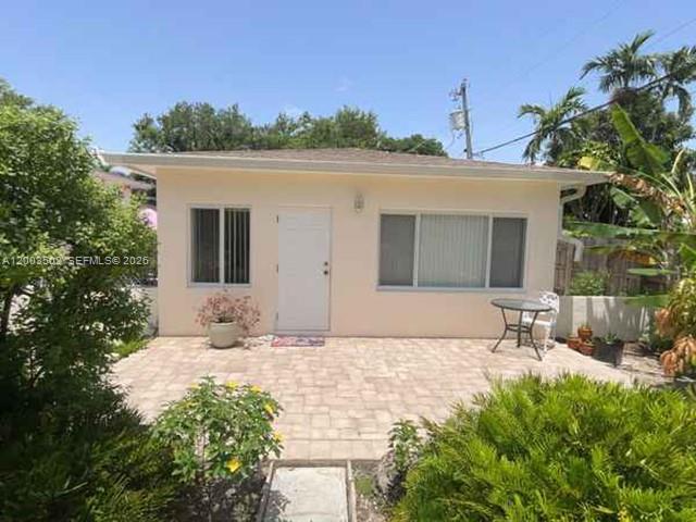 5701 Southwest 50th Terrace Miami, FL 33155 - Photo 26 of 46 a backyard of a house with table and chairs