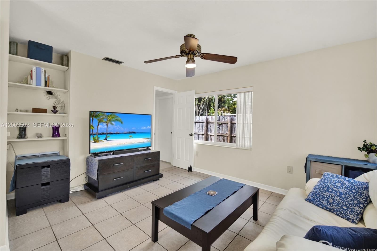 5701 Southwest 50th Terrace Miami, FL 33155 - Photo 27 of 46 a living room with furniture and a flat screen tv