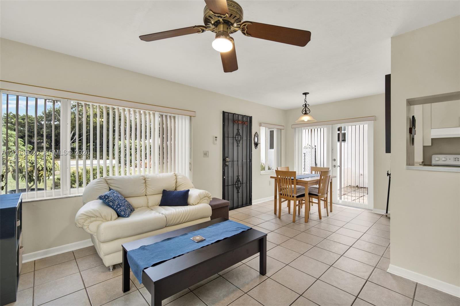 5701 Southwest 50th Terrace Miami, FL 33155 - Photo 28 of 46 a living room with furniture and a large window
