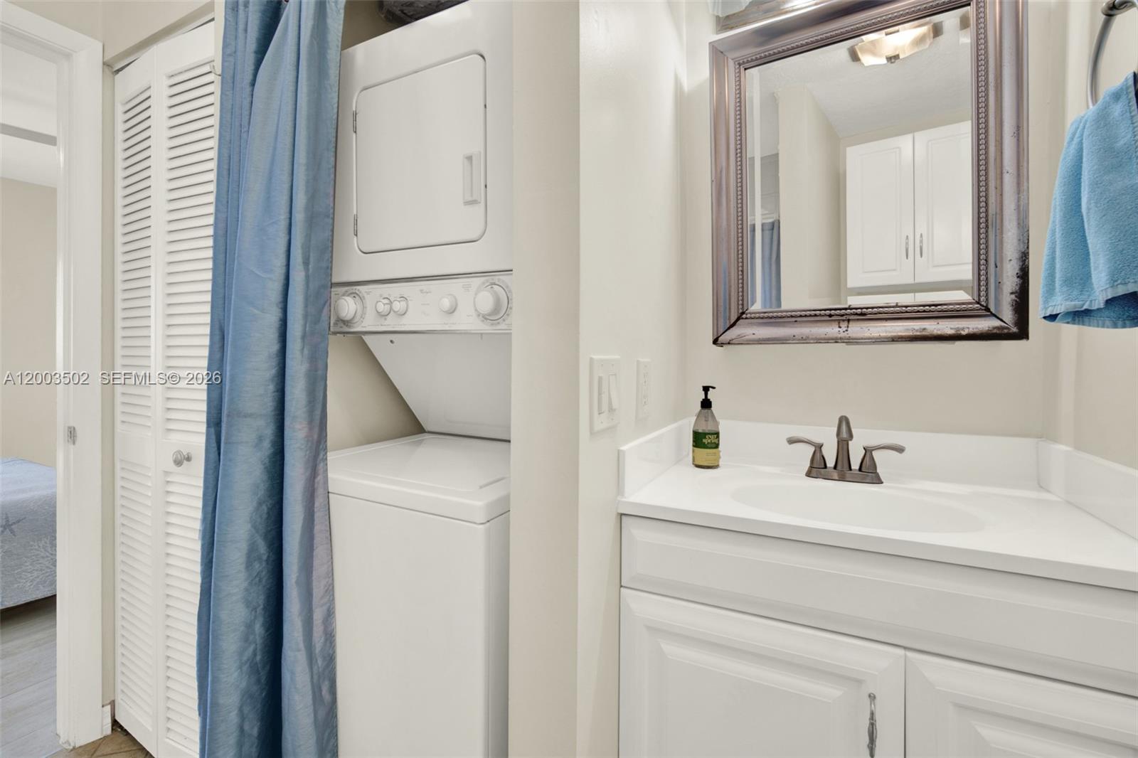 5701 Southwest 50th Terrace Miami, FL 33155 - Photo 33 of 46 a bathroom with a sink and a mirror