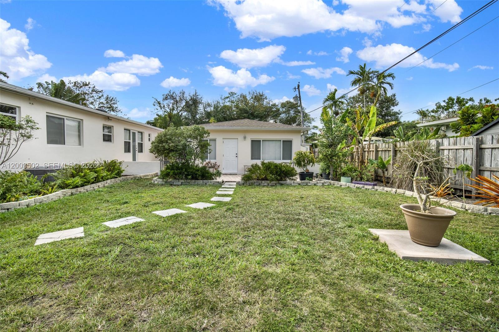 5701 Southwest 50th Terrace Miami, FL 33155 - Photo 36 of 46 a view of a backyard with plants and a patio