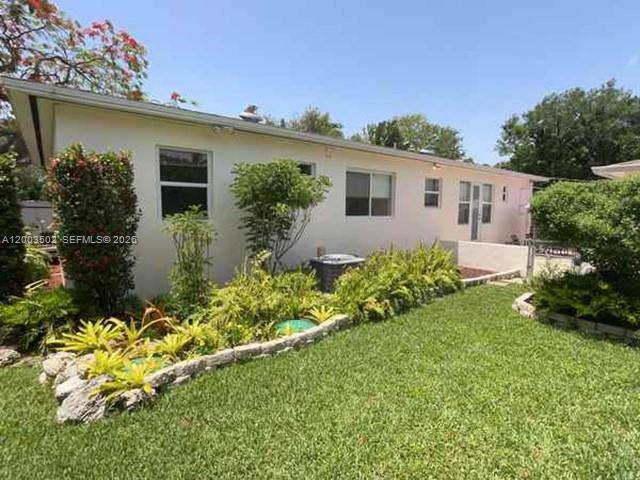 5701 Southwest 50th Terrace Miami, FL 33155 - Photo 4 of 46 a front view of a house with garden