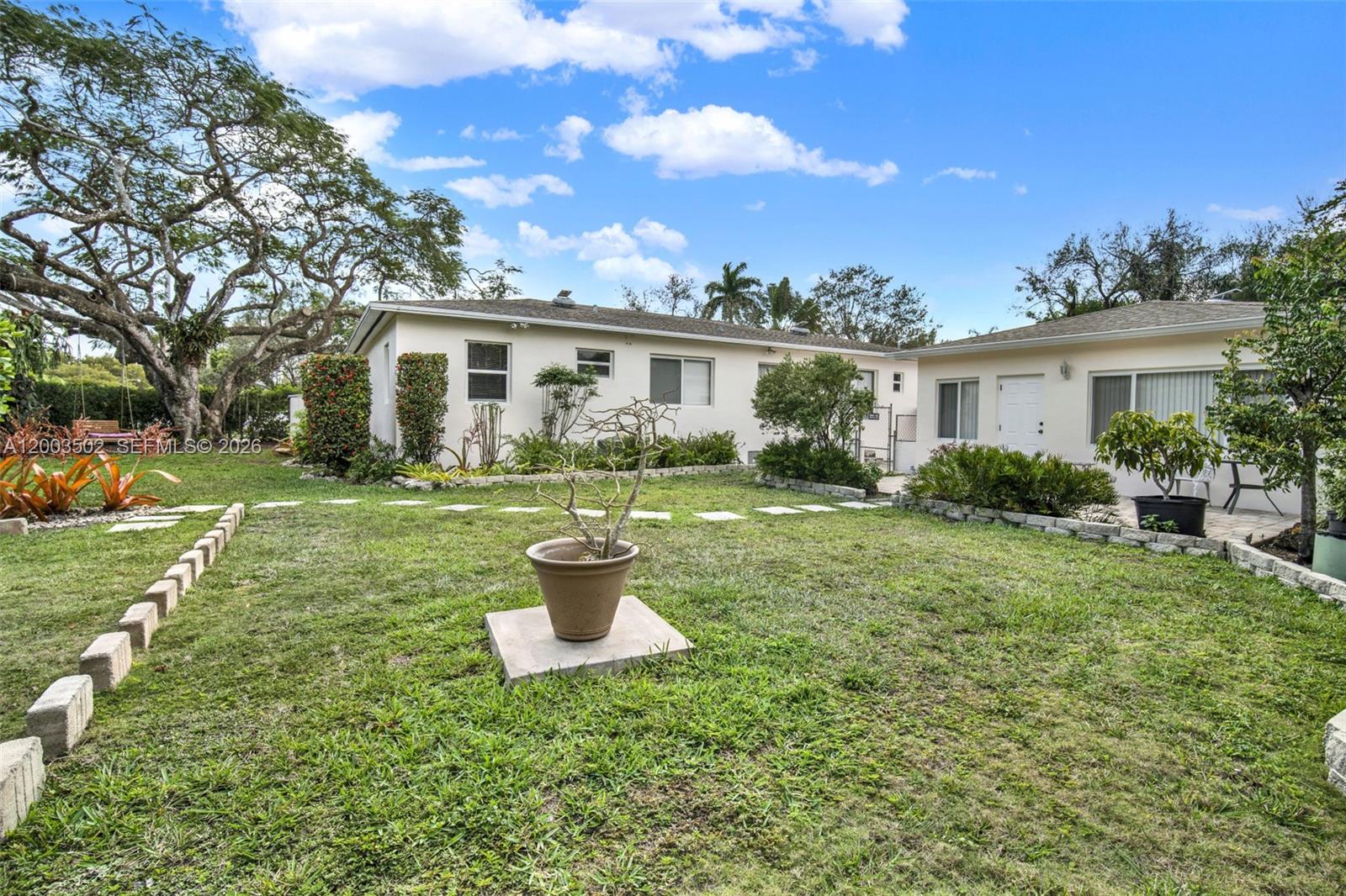 5701 Southwest 50th Terrace Miami, FL 33155 - Photo 5 of 46 a house view with a garden space