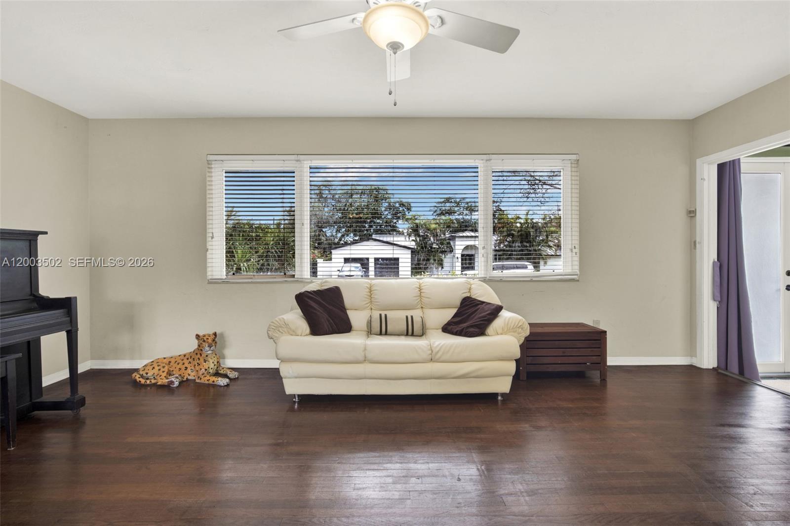 5701 Southwest 50th Terrace Miami, FL 33155 - Photo 6 of 46 a living room with furniture and a large window