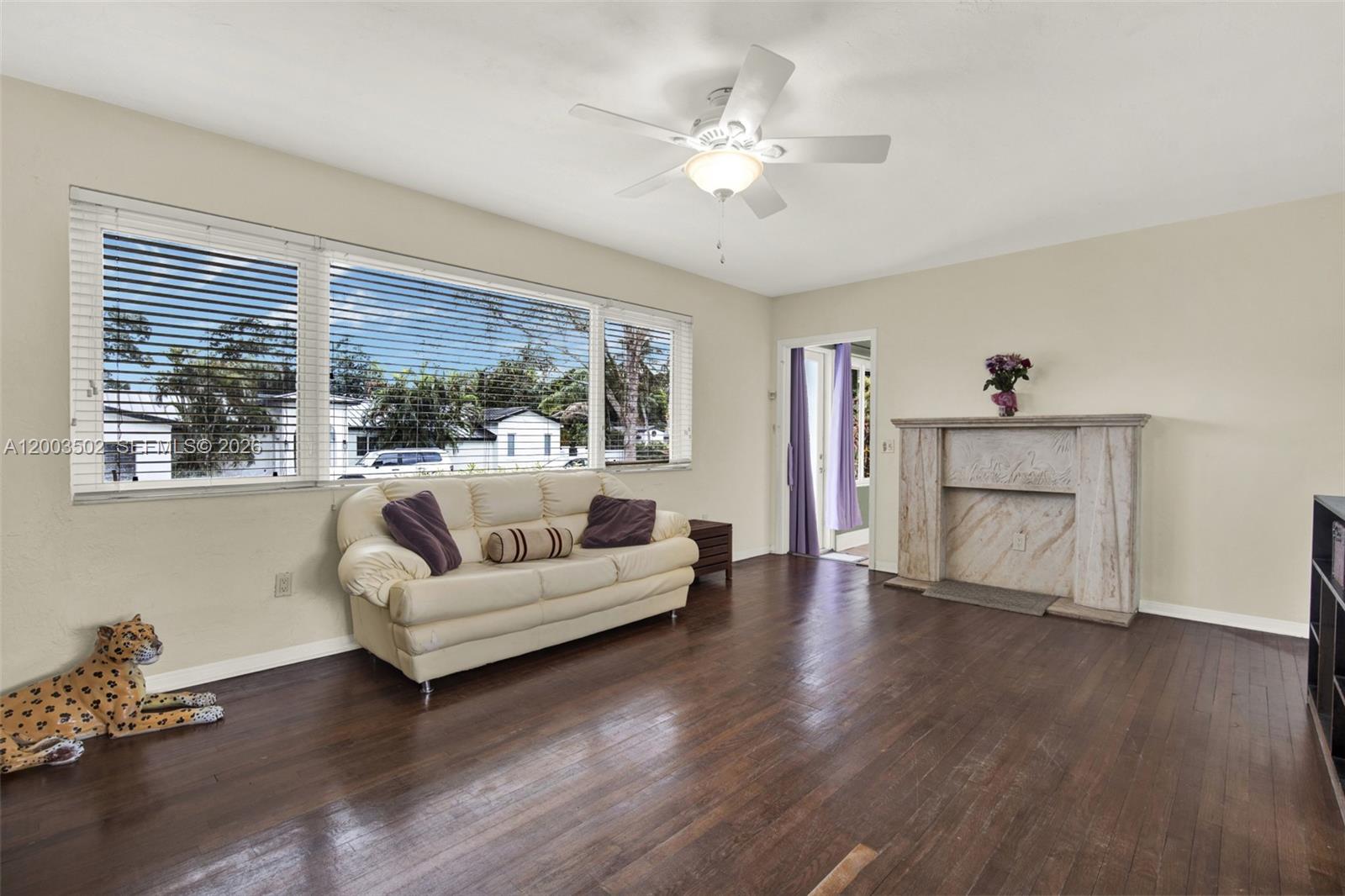 5701 Southwest 50th Terrace Miami, FL 33155 - Photo 7 of 46 a living room with furniture and a large window