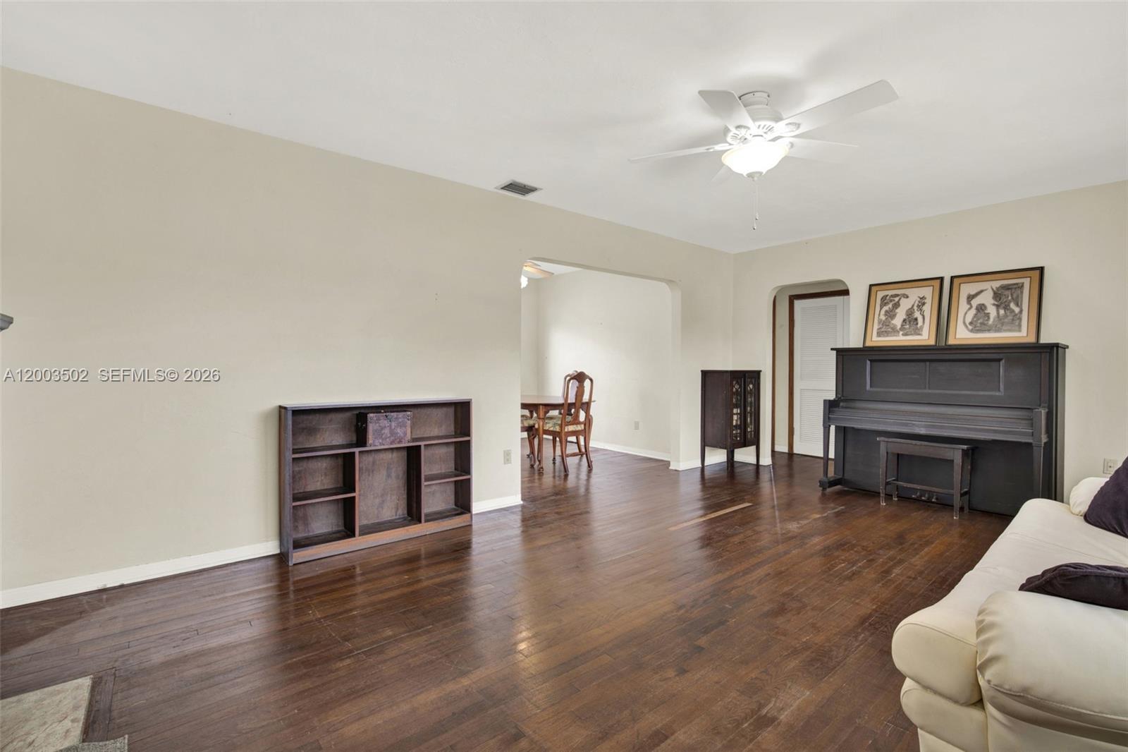 5701 Southwest 50th Terrace Miami, FL 33155 - Photo 8 of 46 a living room with furniture and a fireplace