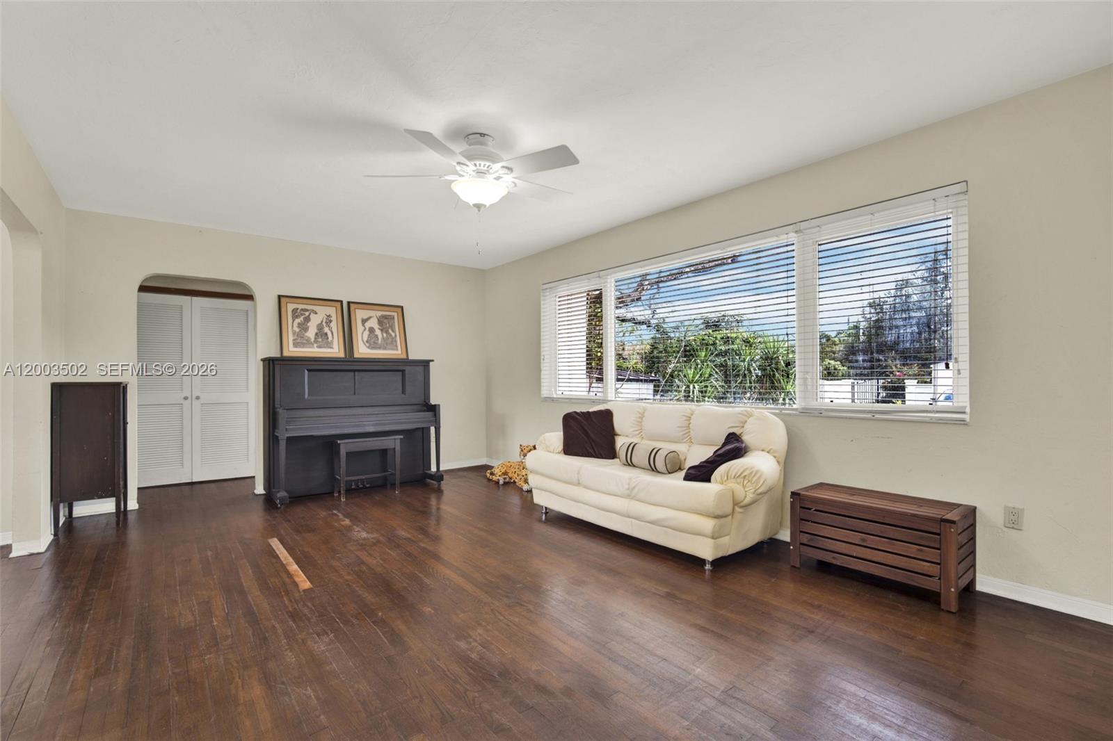 5701 Southwest 50th Terrace Miami, FL 33155 - Photo 9 of 46 a living room with furniture and a fireplace